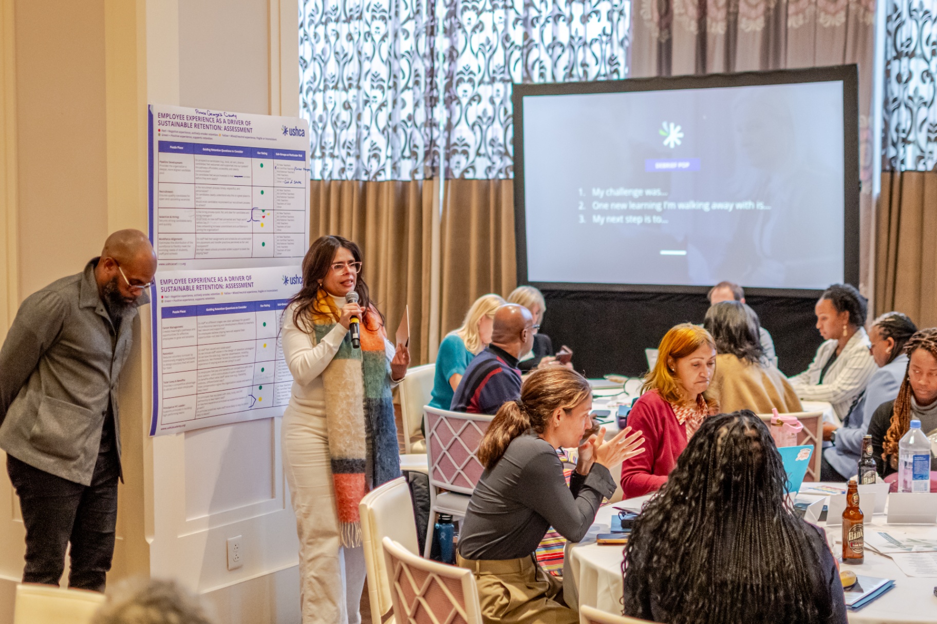 Participant sharing reflections at the mic