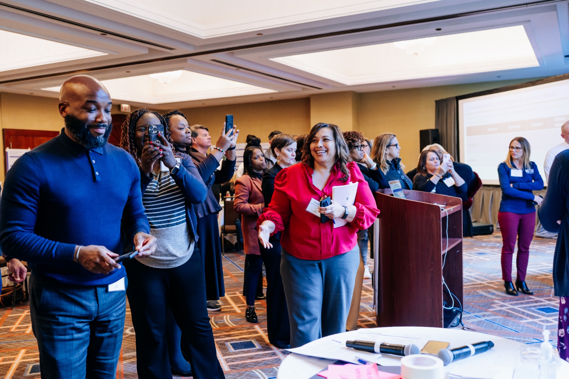 Attendees capturing a moment during the Academy